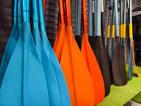 A collection of oars is lined up neatly in a row for useの写真素材