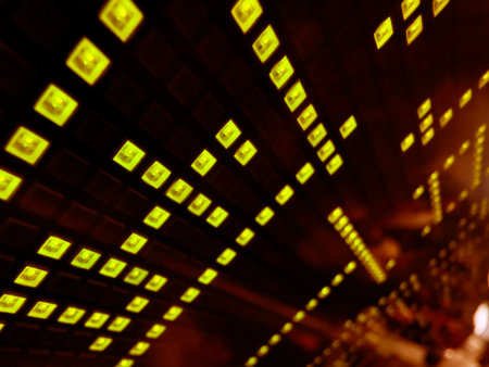 A vibrant rows of bright digital squares is neatly lined up formation on dark backgroundの写真素材