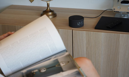 On the table lies a smart speaker.