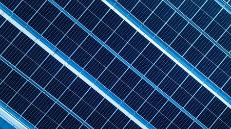 Energy efficient rooftop with multiple solar panels installed on a contemporary mall
