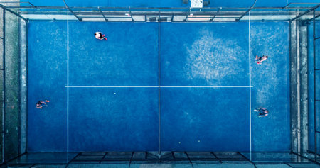 Aerial view of practice people at the blue paddle tennis courts