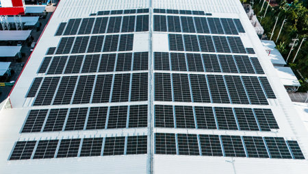 Energy efficient rooftop with multiple solar panels installed on a contemporary mallの写真素材