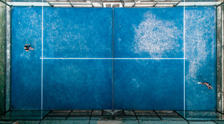 Aerial view of practice people at the blue paddle tennis courtsの写真素材