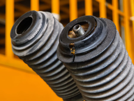 Pile of rusted motor components and gears in cluttered scrap heap