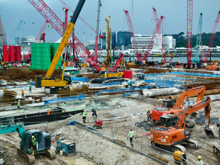 Active construction team erects building with tools and supports
