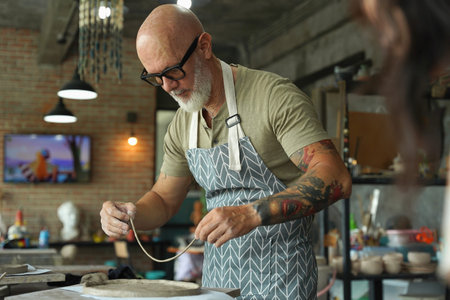 A happy couple makes ceramic plates in a workshop