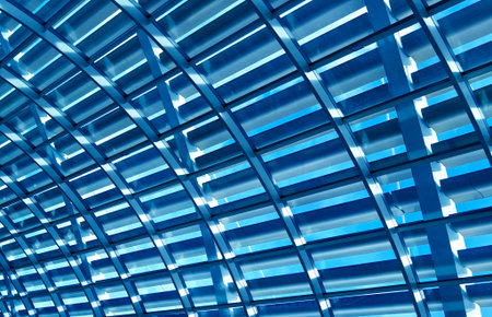 Glass canopy showcasing repeating geometric frames and day light
