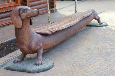wooden bench in the shape of a dogの写真素材