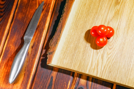 tomato on a chopping Board as background