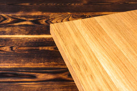 cutting Board on a wooden background top viewの写真素材