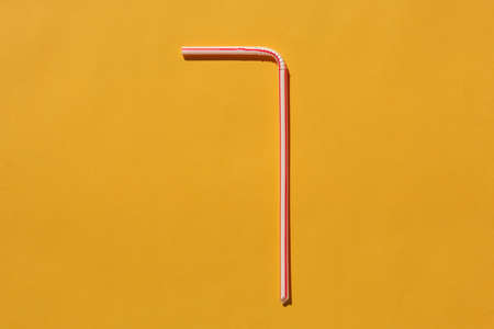 tubes for drinks on a yellow background macro. place for the label. High quality photoの写真素材