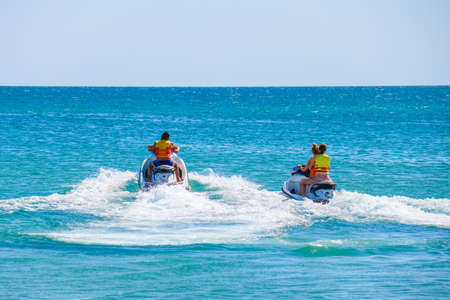 a man rides a jet ski in the open seaの写真素材