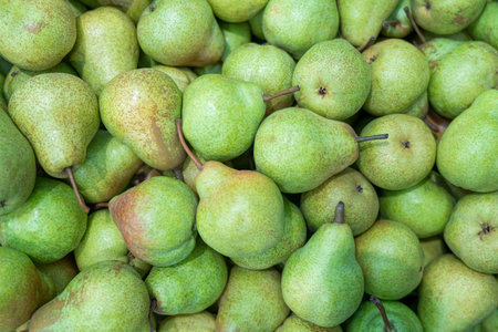 ripe pears close up on the shelves of supermarket stores