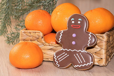 ginger cookies. tangerines in the basket. spruce branch