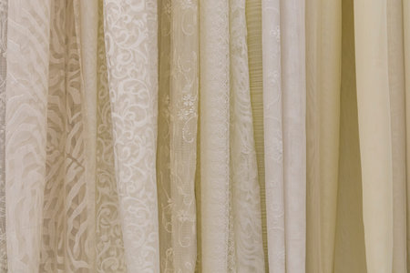 multicolored textures of fabrics on the shelves of stores close-up