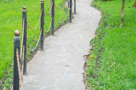 a path of stones with chains leading to nowhere
