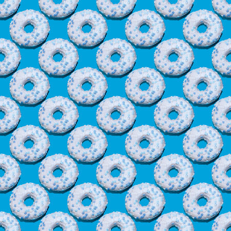 seamless donut pattern with a shadow on a blue background