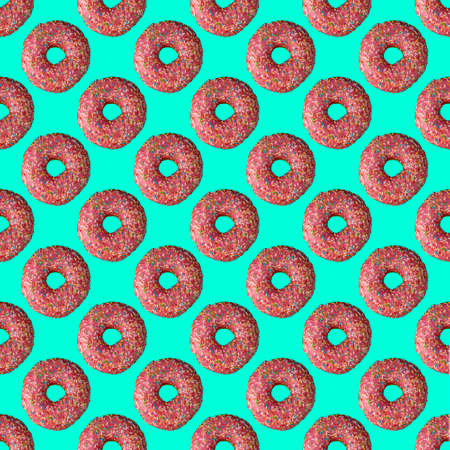 seamless donut pattern with a shadow on a turquoise backgroundの写真素材