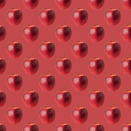seamless pattern red apple on red backgroundの写真素材