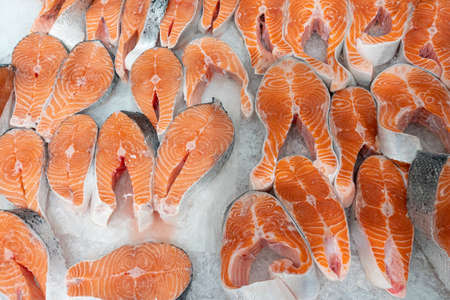 chunks of red fish in ice close-upの写真素材