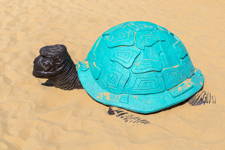 the figure of a turtle on the sand close-upの写真素材