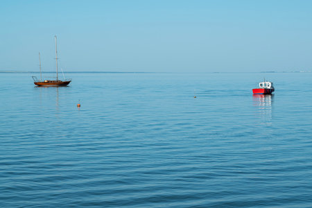 yachts on the water against the blue skyの写真素材