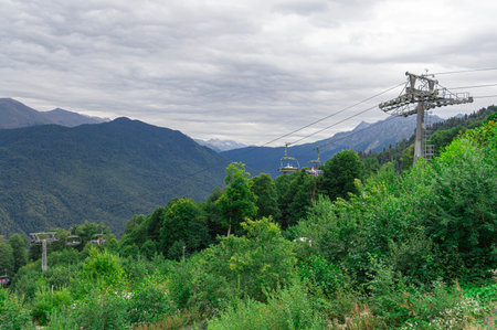 lifts of the mountain cable car on the background of mountainsの写真素材