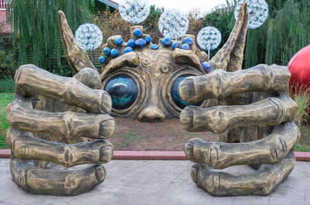 sculpture of a scary troll in the park