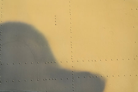 the texture of painted metal with rivets