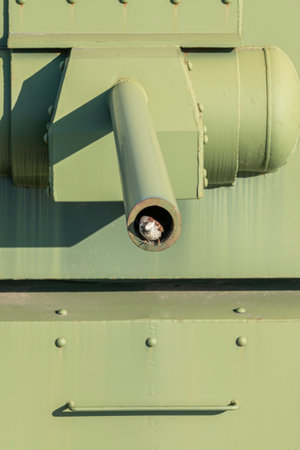 Close-up of a green military tank barrel highlighting its detailsの写真素材