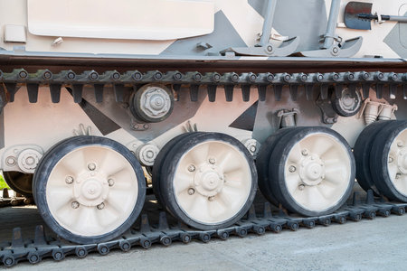 Military Tank Tracks Highlighting Wheels and Treads in Outdoor Displayの写真素材