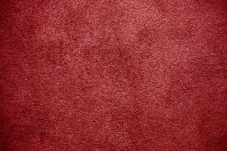Red plaster wall backgroundの写真素材