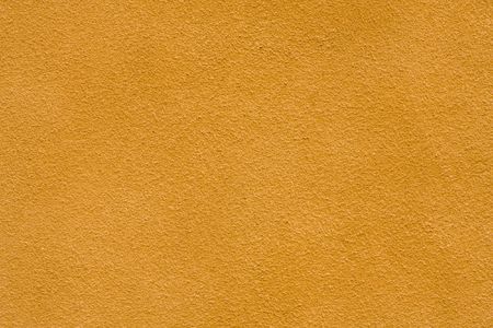 Yellow plaster wall backgroundの写真素材