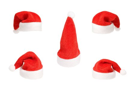 Set of five small Santa red hat isolated on white backgroundの写真素材