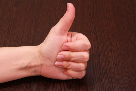 Female hand, gesture of approvalの写真素材