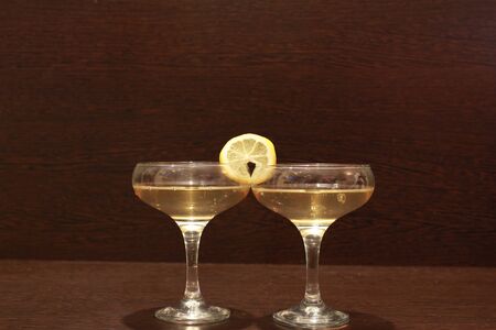 Two glasses of wine and lemonの写真素材