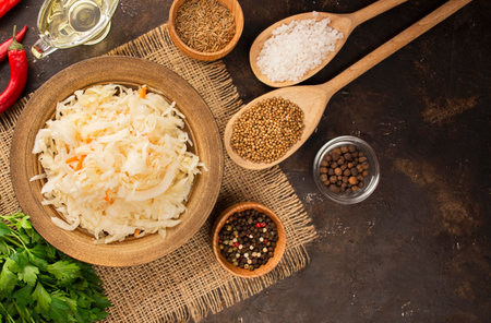Sauerkraut with carrots in a bowl. fermented food. homemade food. Pickled food. Pickled vegetables. Vegetarian vegan food. View from above .の写真素材