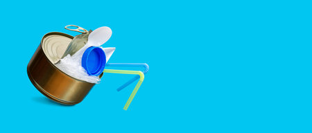 environmental pollution. An open can with garbage instead of fish on a blue background. Pollution of the ocean and fresh water. Banner. copyspace.の写真素材