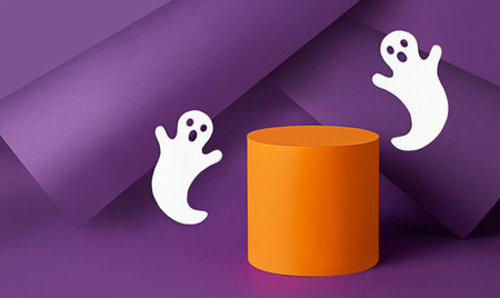 Halloween concept. Orange podium with ghosts on purple background.Halloween background. copyspace.の写真素材
