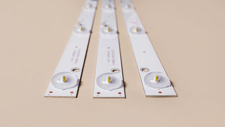 LED strips with lamps for an LCD TV or monitor on a light background. Repair of TVs, monitors. Side...