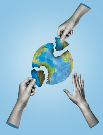 Earth destruction concept. Hands tearing the Earth on a blue background. Earth Day. Art collage.の写真素材