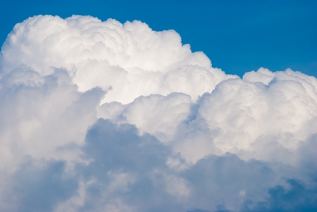 beautiful white cumulus  clouds in blue sunny skiesの写真素材