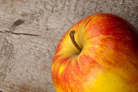 Apple on an old woodの写真素材