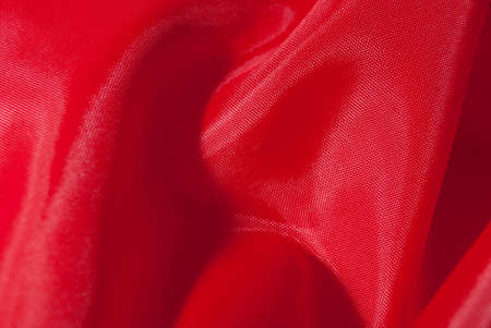 Macro shot of red fabric, useful as a background textureの写真素材