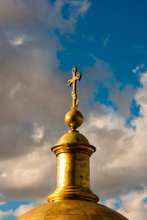 christian cross against blue cloudy skiesの写真素材