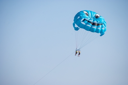 two persons parasailing on seaの写真素材