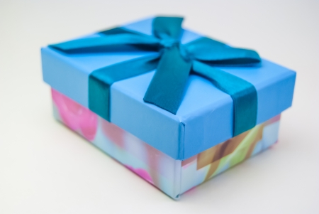 gift box with ribbon and bow isolated on whiteの写真素材