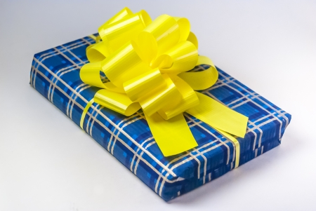 gift box with ribbon and bow isolated on whiteの写真素材