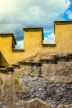 medieval stone battlement with skyの写真素材