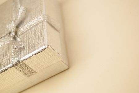 gift box with ribbon and bow isolated on whiteの写真素材